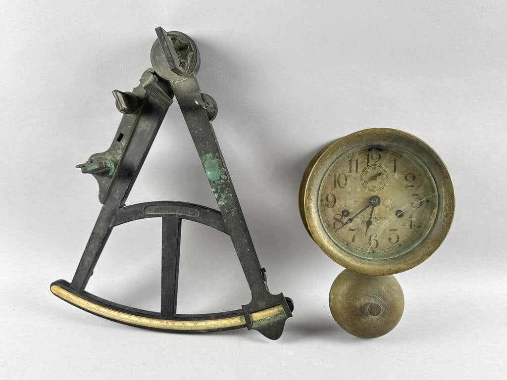 TWO MARINE INSTRUMENTS Early 20th Century: TWO MARINE INSTRUMENTSEarly 20th Century1) Seth Thomas ship's bell clock with exposed bell. Diameter 7". 2) Octant. Length 15.5".