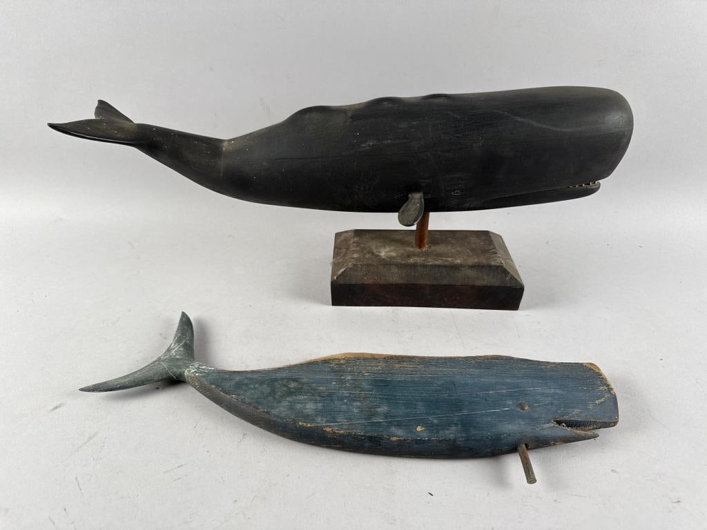 TWO FOLK ART SPERM WHALE CARVINGS 20th Century: TWO FOLK ART SPERM WHALE CARVINGS20th CenturyA blue painted weather vane with tack eyes, length 17.5", and one mounted on a wood base, length 20".