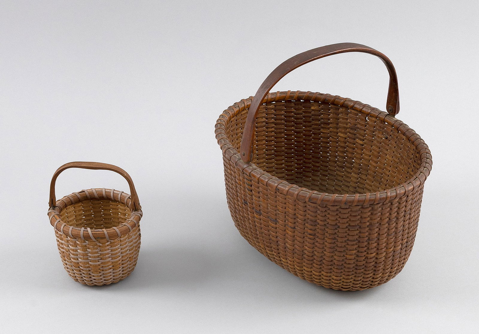 TWO NANTUCKET BASKETS Early 20th Century Heights to rim 2.75" and 5". (1 of 2)