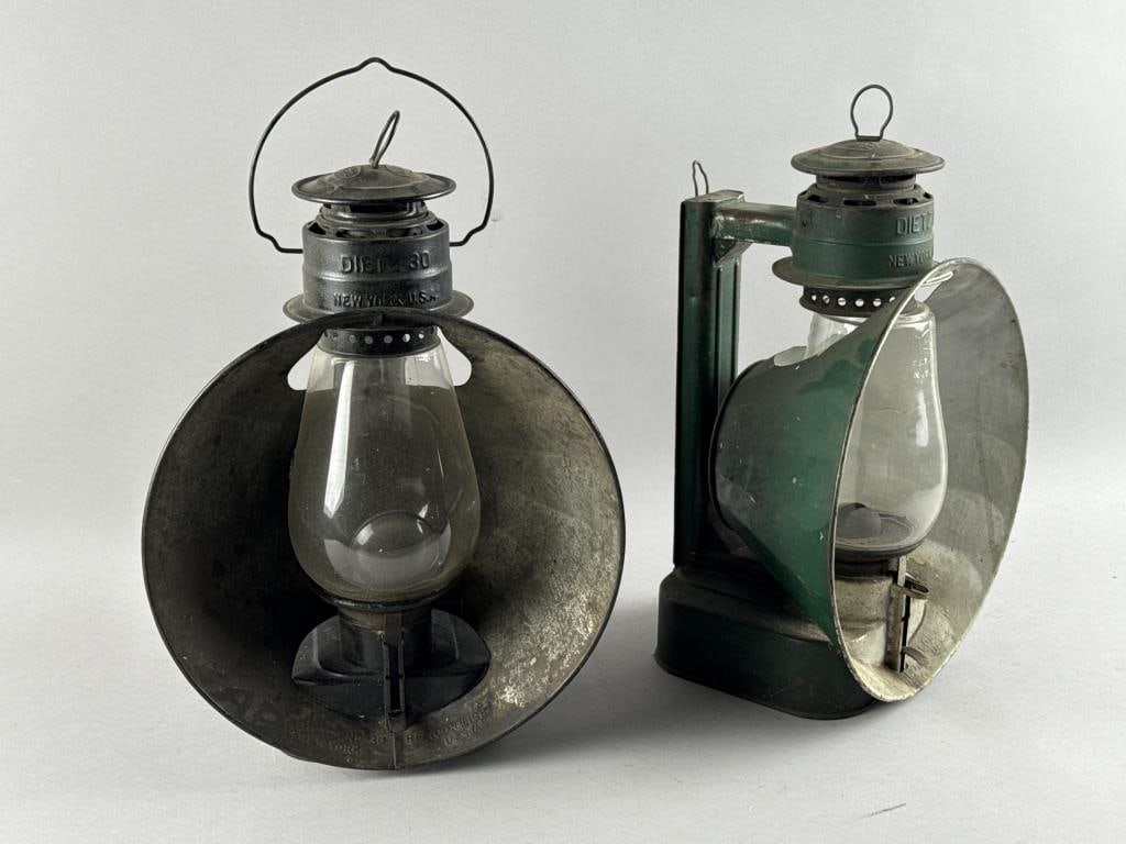 TWO DIETZ REFLECTOR LANTERNS Late 19th/Early 20th Century Heights 15".: TWO DIETZ REFLECTOR LANTERNSLate 19th/Early 20th CenturyBoth tin, one painted green and the other black. Fluid reservoirs at bases. One with magnifying globe.Heights 15".