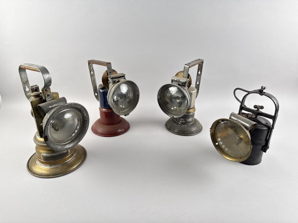 FOUR BATTERY-OPERATED HAND LAMPS Late 19th/Early 20th Century Heights from 9.5" to 11.25".: FOUR BATTERY-OPERATED HAND LAMPSLate 19th/Early 20th CenturyBy Lux, Oxweld and National Carbide.Heights from 9.5" to 11.25".