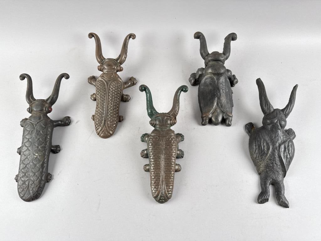 FIVE CAST IRON CRICKET-FORM BOOTJACKS Late 19th/Early 20th Century Lengths from 12" to 12.75". (1 of 2)