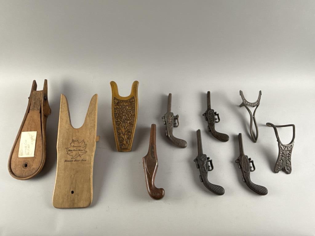 TEN BOOTJACKS 19th Century Lengths to 14.75".: TEN BOOTJACKS19th Century1) Wheeler Case & Co. folding wooden.2) Acme wooden with flower and foliate design.3) Booher wooden.4) Pistol-form folding wooden.5-8) Four pistol-form folding cast iron, one