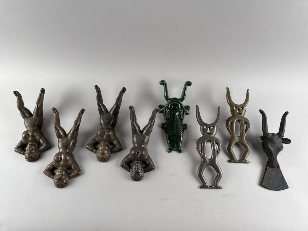 EIGHT CAST IRON BOOTJACKS 19th Century: EIGHT CAST IRON BOOTJACKS19th Century1-4) Four "Naughty Nellies". Lengths from 9.5" to 10.5".5-6) Two smiling devils. Lengths 10.5" and 10.75".7) Steer head. Length 10.5".8) Green enameled fish. Lengt