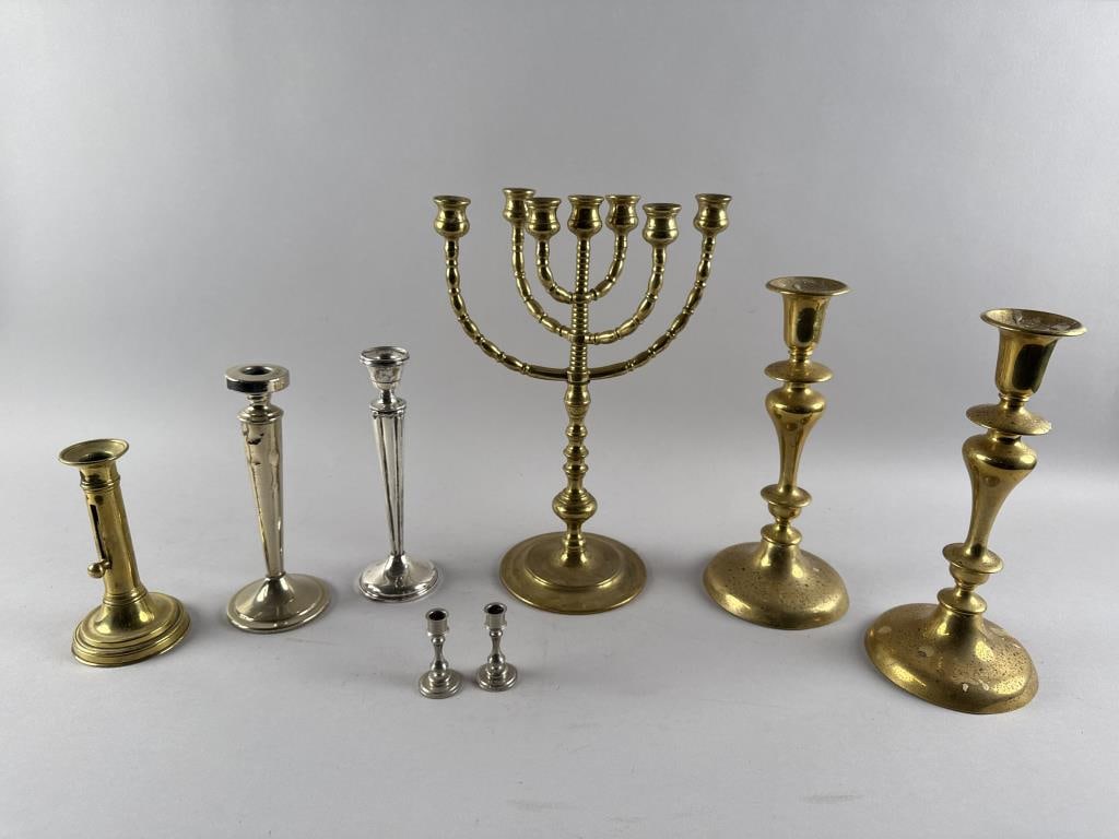 EIGHT CANDLESTICKS 19th Century Heights from 2.5" to 14.25". Widths from 1.5" to 5.75".: EIGHT CANDLESTICKS19th Century1) Brass candelabrum with three arms and a total of seven candle cups.2-3) Pair of brass candlesticks. 4-5) Pair of miniature silver metal candlesticks. 6) Brass push-up