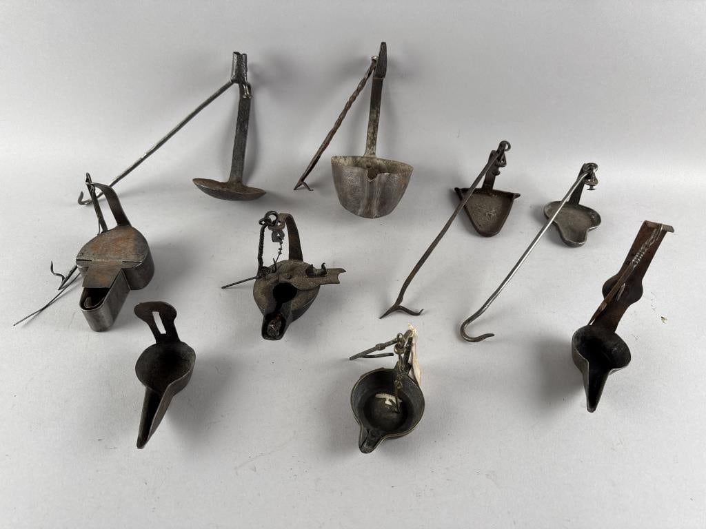 EIGHT IRON AND STEEL BETTY LAMPS Late 18th/Early 19th Century Lengths to approx. 17".: EIGHT IRON AND STEEL BETTY LAMPSLate 18th/Early 19th CenturySeveral with adjustable trammel arms.Lengths to approx. 17".