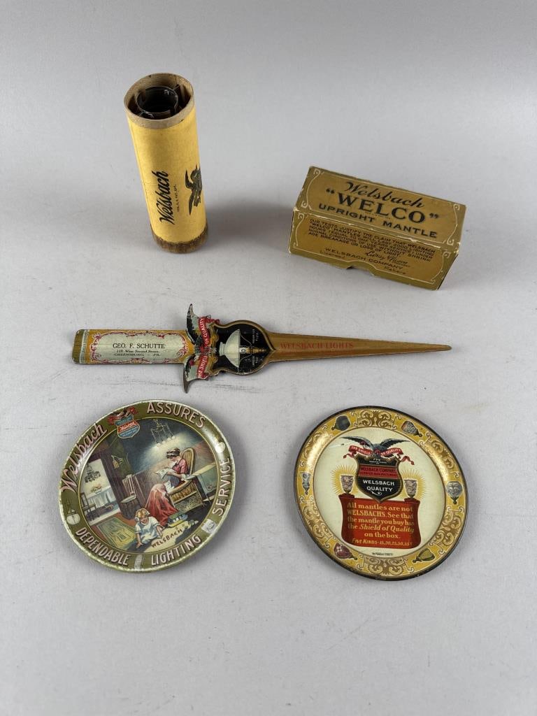 FIVE PIECES OF WELSBACH ADVERTISING 19th Century: FIVE PIECES OF WELSBACH ADVERTISING19th Century1-2) Two differing painted tin coasters. Diameters 4.25".3) "'Welco' Upright Mantle" in its original box. Box height 1.75". Width 4.75". Depth 2".4) Pain