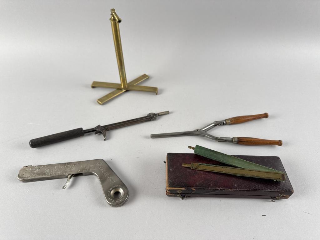FIVE ITEMS Lengths from 5.5" to 9.75".: FIVE ITEMS1) Larsen's Shoot-A-Lite.2) Cased fan shield.3) Friction lighter.4) Curling iron.5) Early iron rush light.Lengths from 5.5" to 9.75".