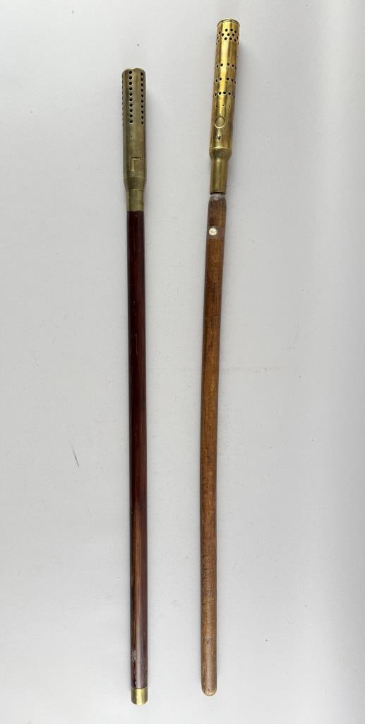 TWO BRASS AND WOOD LAMP POST LIGHTERS Late 19th/Early 20th Century Heights 38" and 41.75". (1 of 2)