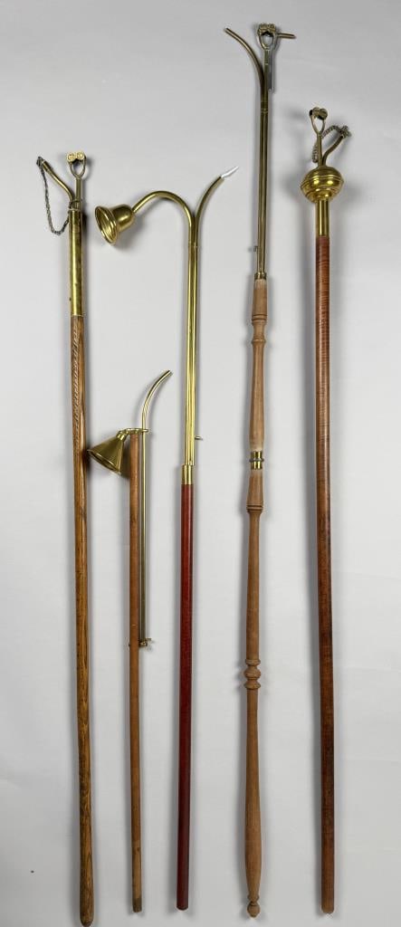 FIVE BRASS ALTAR LIGHTERS Lengths from 43" to 57". (1 of 3)