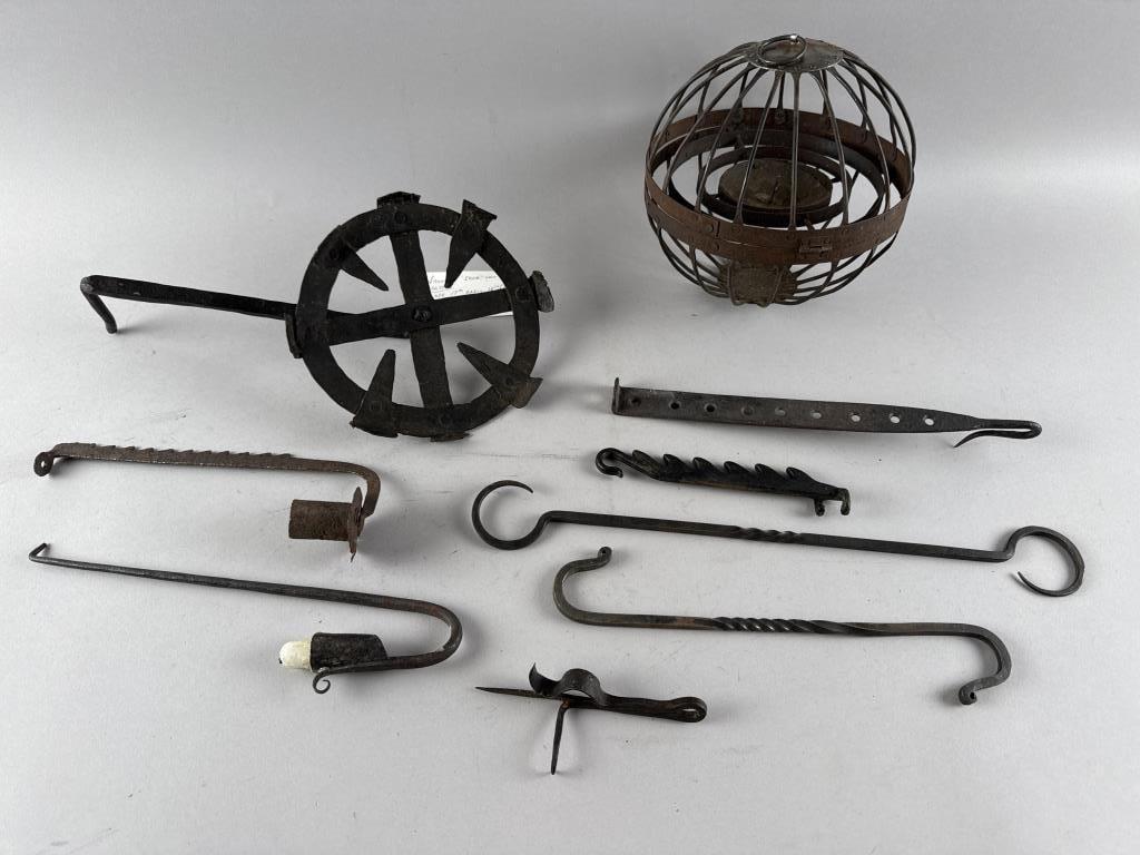 NINE LIGHTING ITEMS 18th/19th Century: NINE LIGHTING ITEMS18th/19th Century1) Steel ship's hanging lantern with gimbaled candle holder. Maximum height 9.5". Diameter 8.5".2) Wrought iron wall cresset. 4.5" x 7.5" x 13.5".3-7) Five wrought