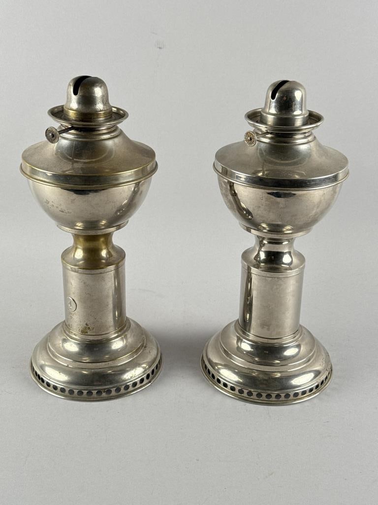 PAIR OF NICKEL PLATED CLOCKWORK TIME LAMPS Late 19th/Early 20th Century Heights 12". (1 of 3)