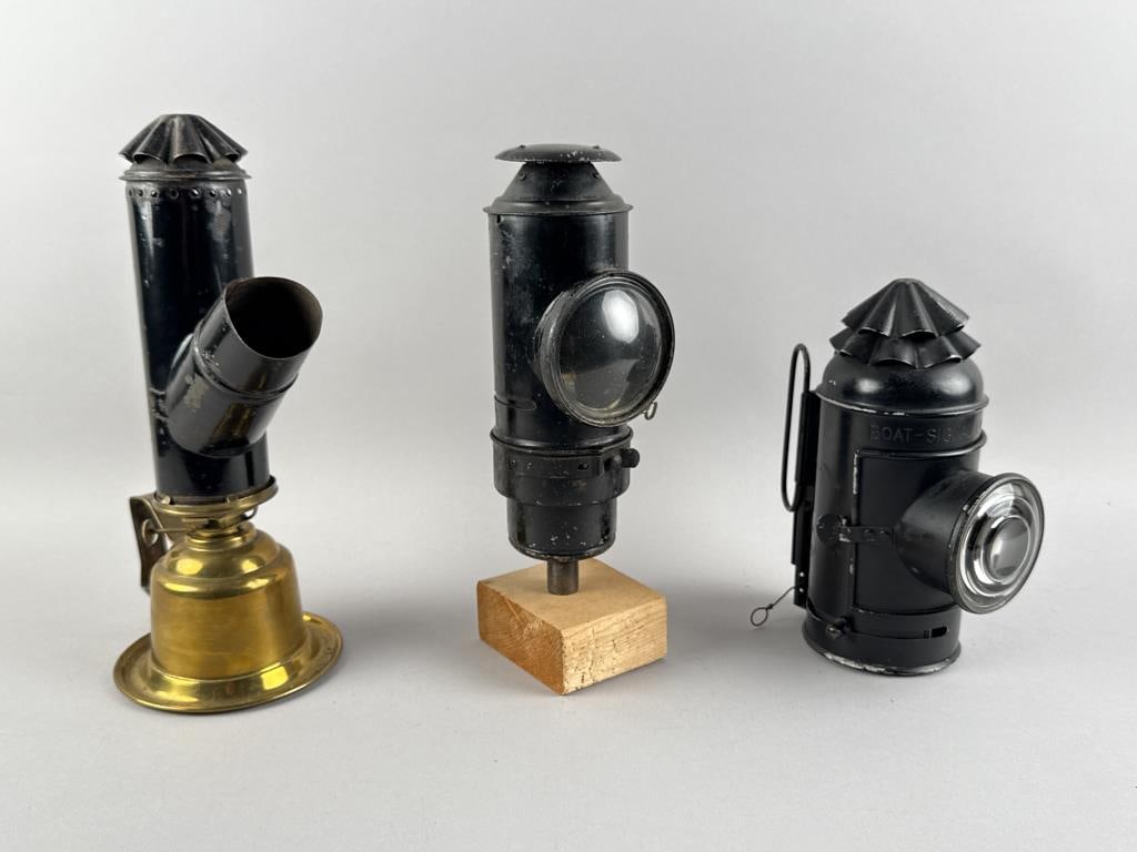 THREE METAL LAMPS WITH MAGNIFYING LENSES Late 19th/Early 20th Century Heights from 8.75" to 12". (1 of 2)