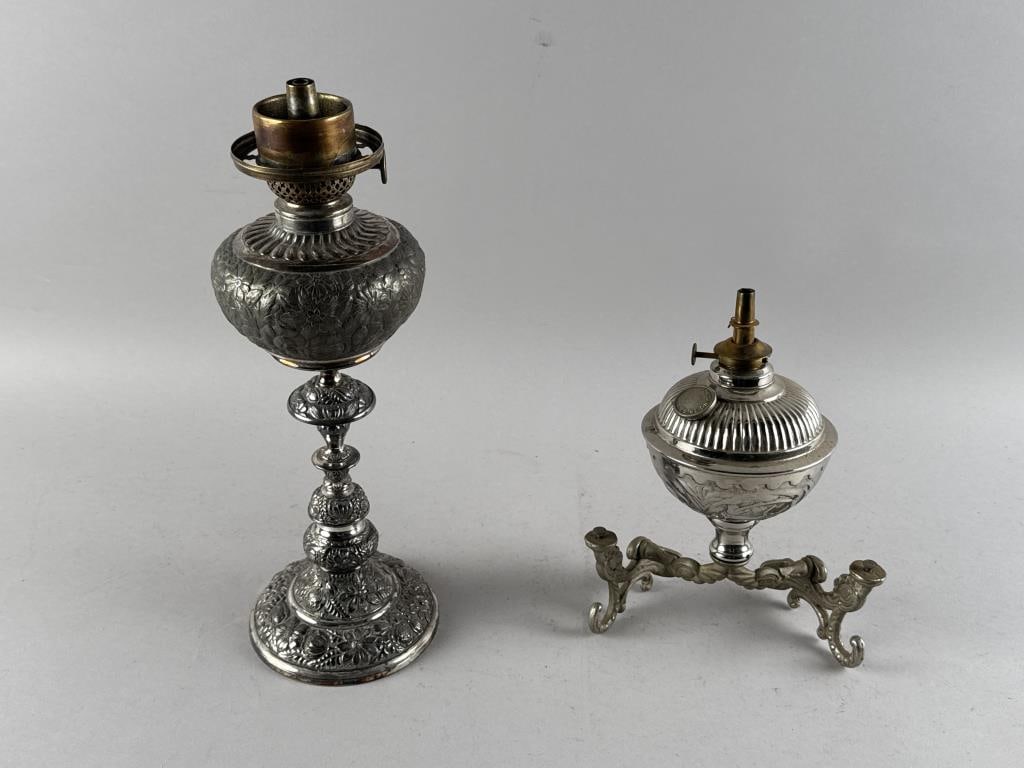 TWO SILVER PLATED OIL LAMPS Late 19th/Early 20th Century Heights 9" and 13". (1 of 2)