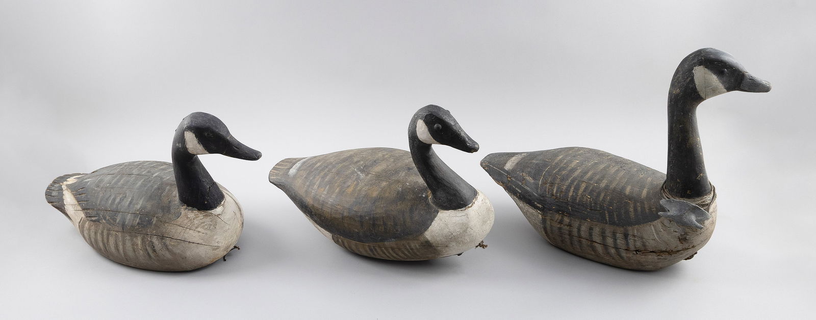 RIG OF THREE MIKE BORRETT GOOSE DECOYS Madison, Wisconsin, 1960- Lengths 19", 20" and 22". (1 of 3)
