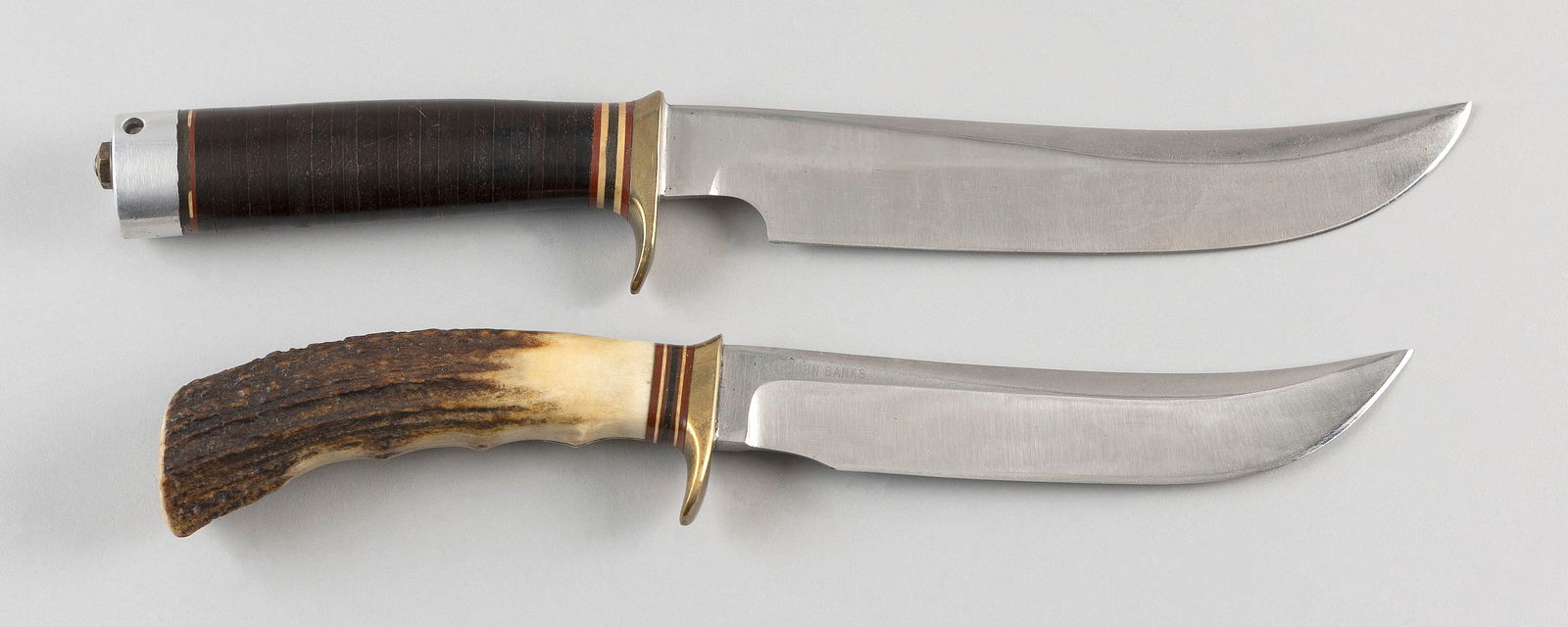 TWO RANDALL KNIVES 20th Century Lengths 11" and 12".: TWO RANDALL KNIVES20th CenturyOne with a stag horn handle and the other with a leather handle.Lengths 11" and 12".