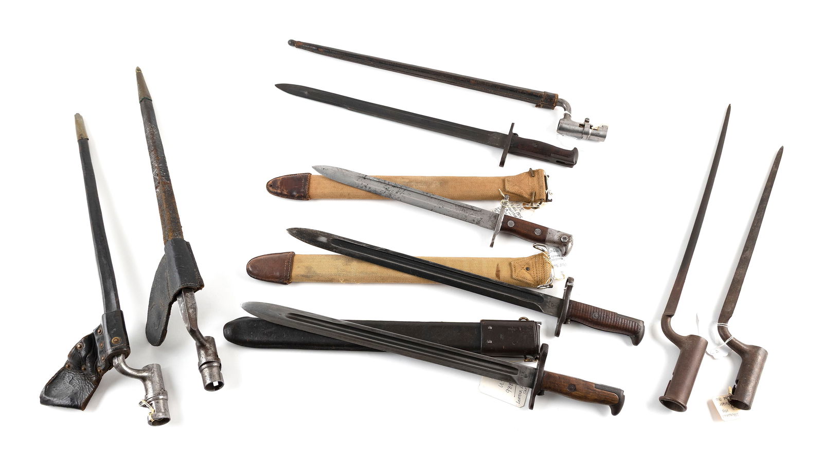 NINE BAYONETS 19th/Early 20th Century Lengths from 18" to 23".: NINE BAYONETS19th/Early 20th Century1-4) Four U.S. Model 1905 bayonets, three with scabbards.5-9) Five socket bayonets.Lengths from 18" to 23".