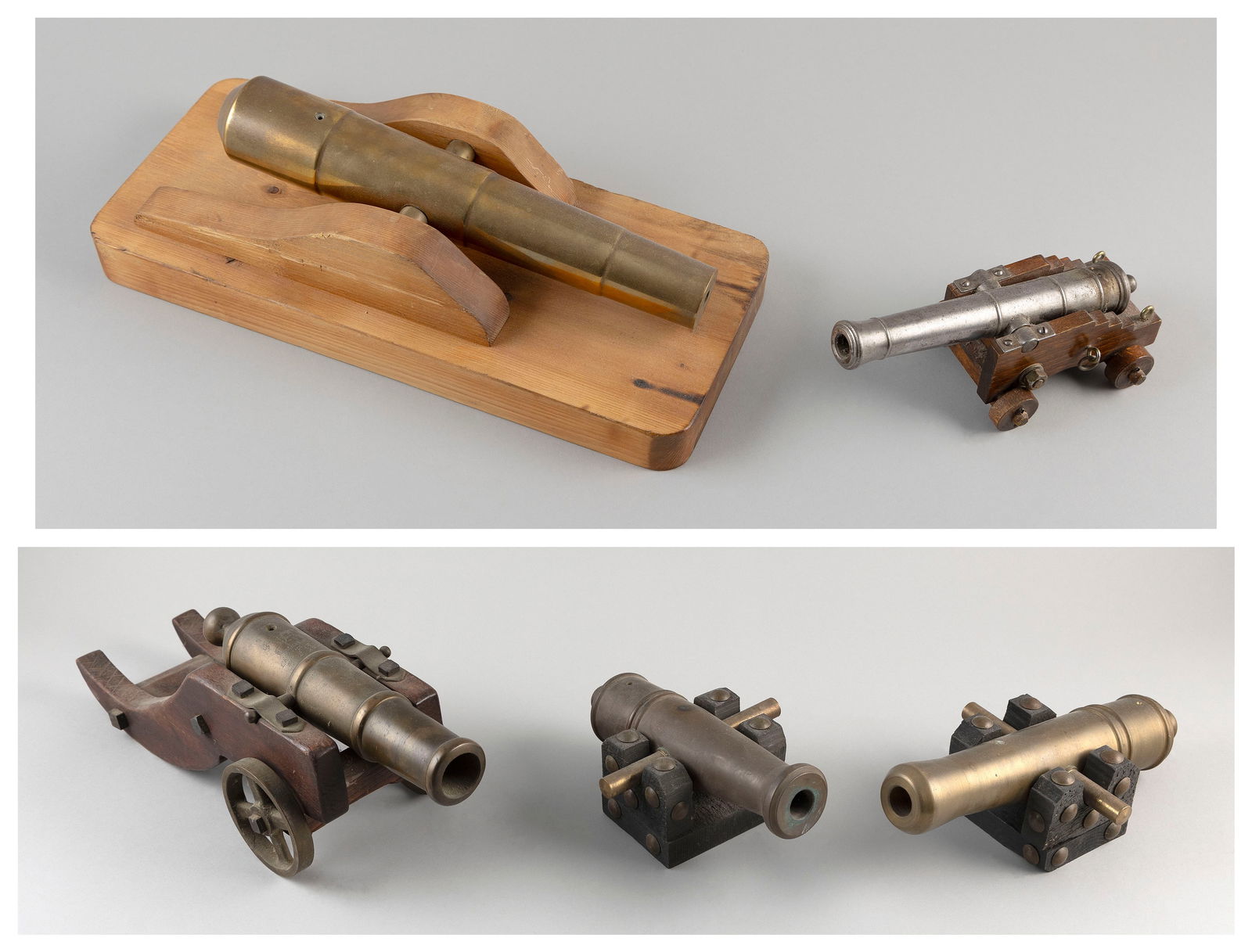 FIVE SMALL REPRODUCTION CANNONS 20th Century Lengths from 9" to 11.5".: FIVE SMALL REPRODUCTION CANNONS20th CenturyBrass cannons on wood carriages, two carriage's with wheels.Lengths from 9" to 11.5".