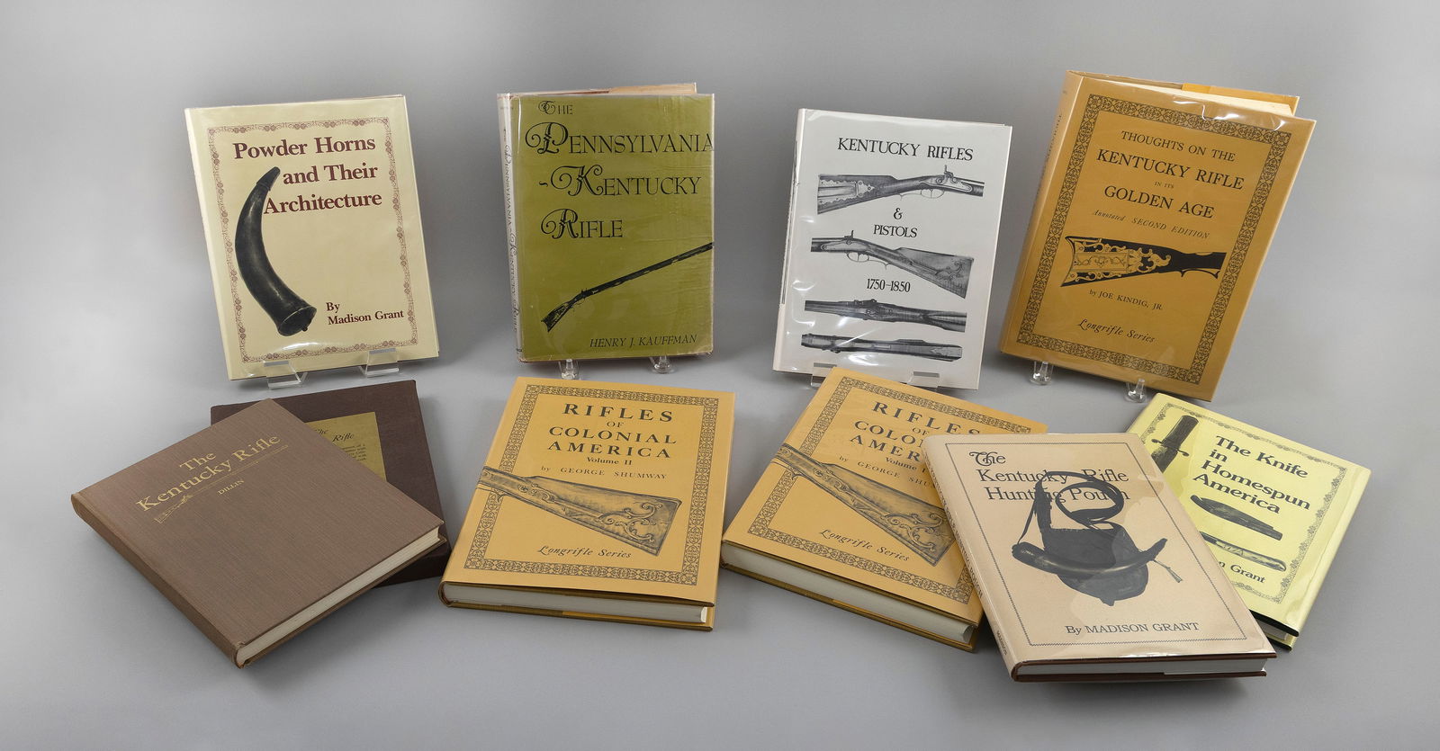 NINE BOOKS ON EARLY AMERICAN RIFLES, POWDER HORNS AND HUNTING POUCHES 20th Century Largest 12" x: NINE BOOKS ON EARLY AMERICAN RIFLES, POWDER HORNS AND HUNTING POUCHES20th Century1) The Knife in Homespun America by Madison Grant.2) Powder Horns and Their Architecture by Madison Grant.3) The K