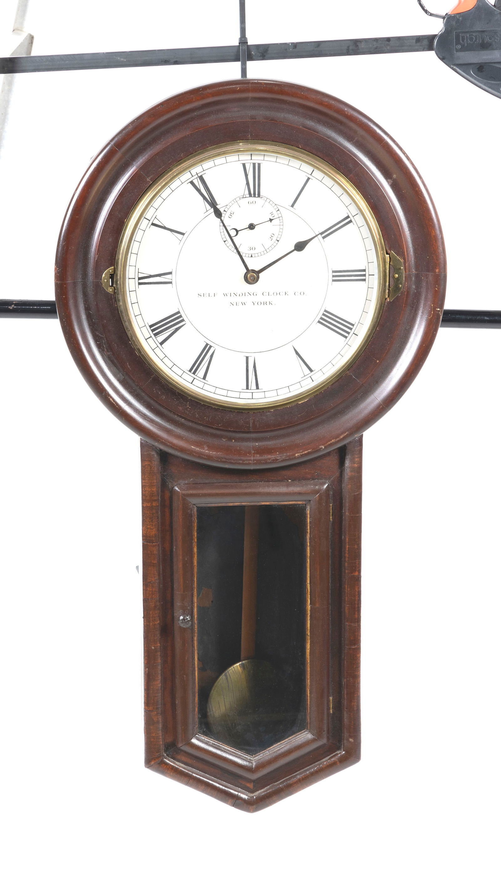 SELF WINDING CLOCK CO. REGULATOR-STYLE CLOCK New York, Late 19th Century Height 36". Dial diameter (1 of 2)