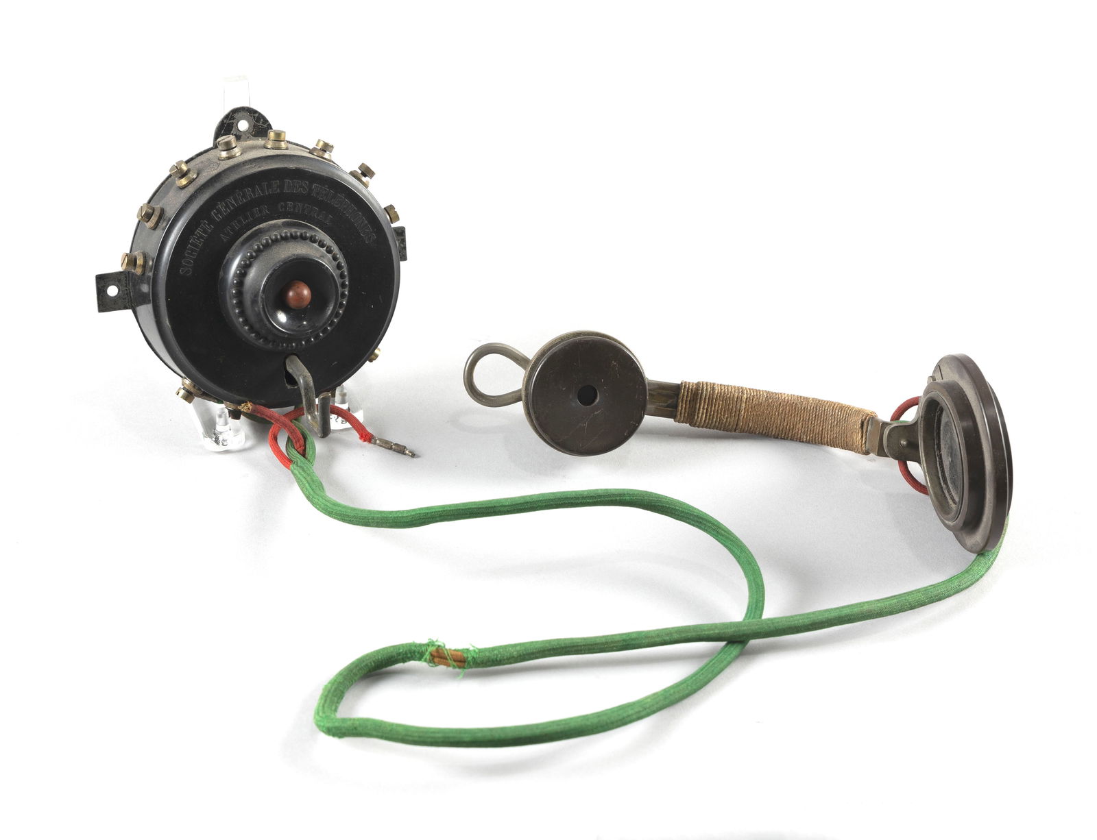 S.G.T. WALL TELEPHONE TRANSMITTER AND RECEIVER France, Late 19th Century Maximum height approx. 15".: S.G.T. WALL TELEPHONE TRANSMITTER AND RECEIVERFrance, Late 19th CenturyMarked on front of wall unit "S.G.T." for Societe Generale des Telephones. Possibly associated with the Berthon-Ader system.Maxim