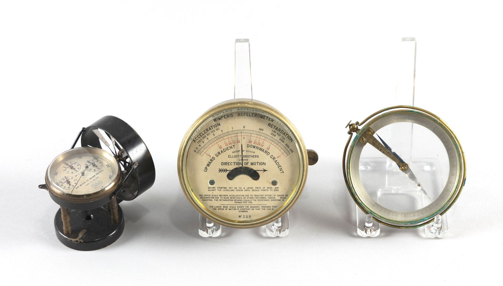 THREE SMALL LEATHER-CASED DEVICES Late 19th/Early 20th Century: THREE SMALL LEATHER-CASED DEVICESLate 19th/Early 20th Century1) Brass compass by W. & L.E. Gurley, Troy, New York. Diameter 3.75".2) Wimperis accelerometer by Elliott Bros., London. Diameter 4.25".3)
