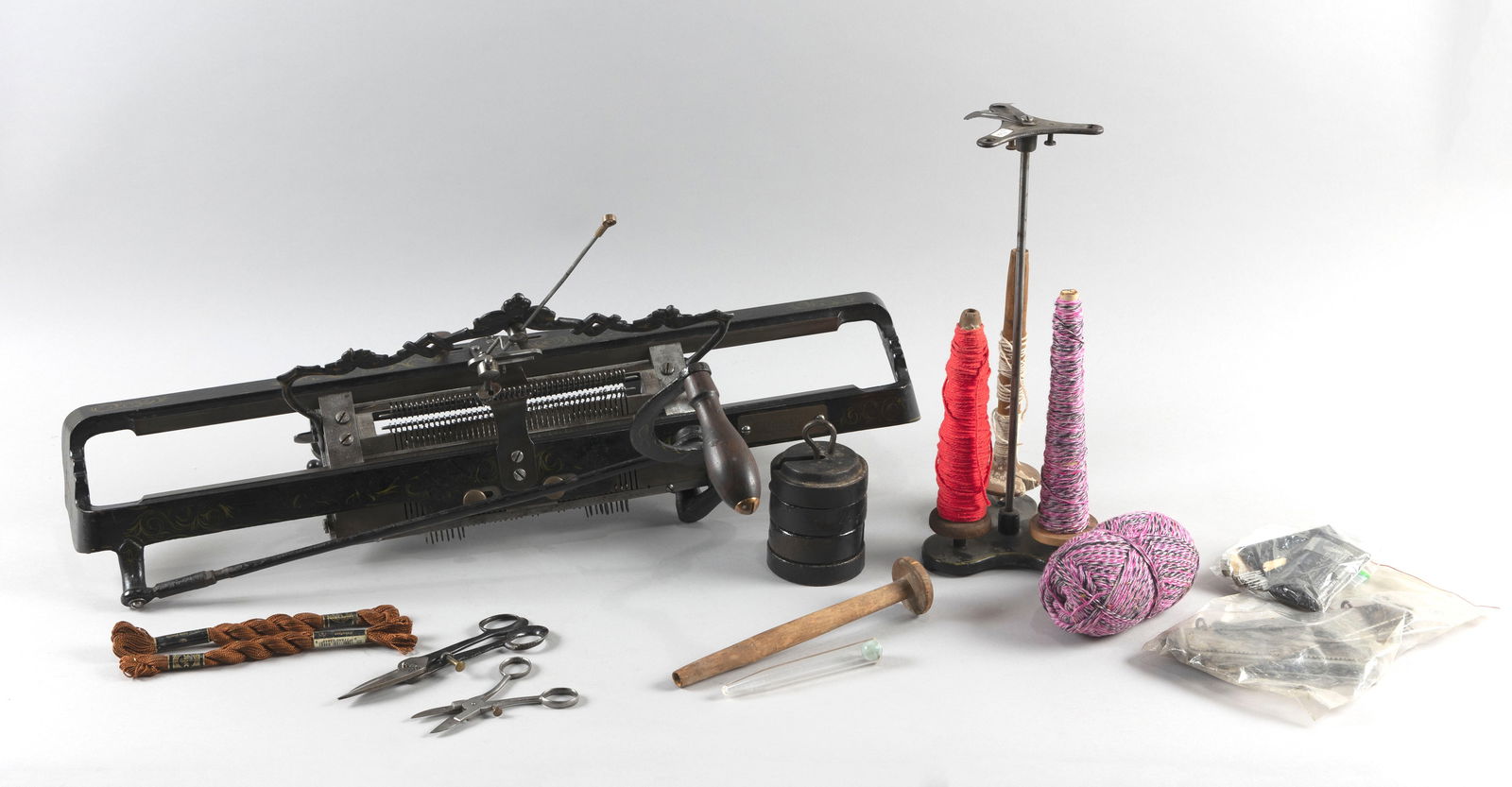 LAMB KNITTING MACHINE Springfield, Massachusetts, Late 19th Century Height 9.25". Length 27". Width: LAMB KNITTING MACHINESpringfield, Massachusetts, Late 19th CenturySerial #1103. Patent dates September 15, 1863, September, 10, 1865, et al., nos. 50,369, et al. With wood handle and brackets for tabl