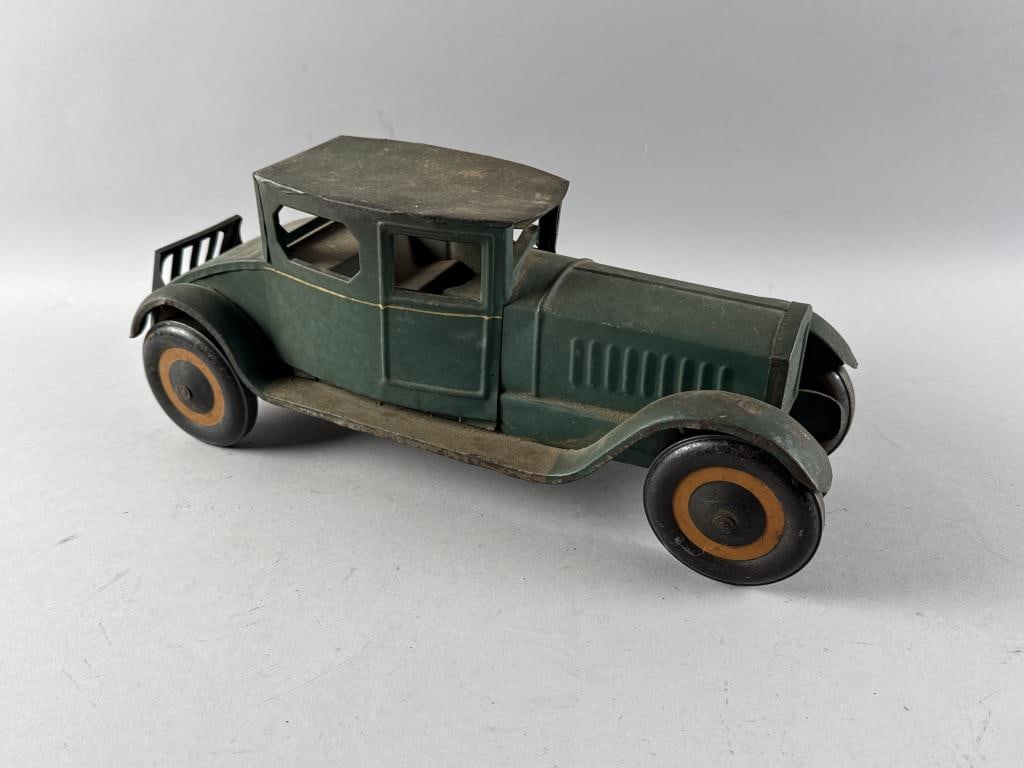 PRESSED TIN TOY CAR America, Circa 1930 Height 7.5". Length 17". (1 of 4)