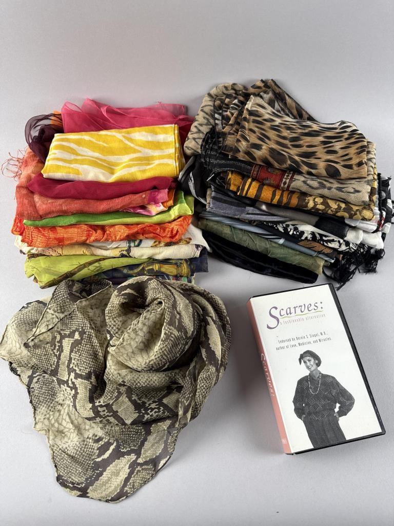 TWENTY-SIX ASSORTED SCARVES AND A FASHION VHS TAPE Late 20th/Early 21st Century: TWENTY-SIX ASSORTED SCARVES AND A FASHION VHS TAPELate 20th/Early 21st CenturySome rayon and cotton but mostly polyester. Varied shapes and sizes. Most lacking care labels. Includes VHS tape "Scarves: