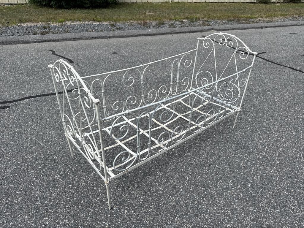 WROUGHT IRON CRIB OR DAY BED Early 20th Century Height 34". Length 55.5". Width 24".: WROUGHT IRON CRIB OR DAY BEDEarly 20th CenturyPainted white.Height 34". Length 55.5". Width 24".