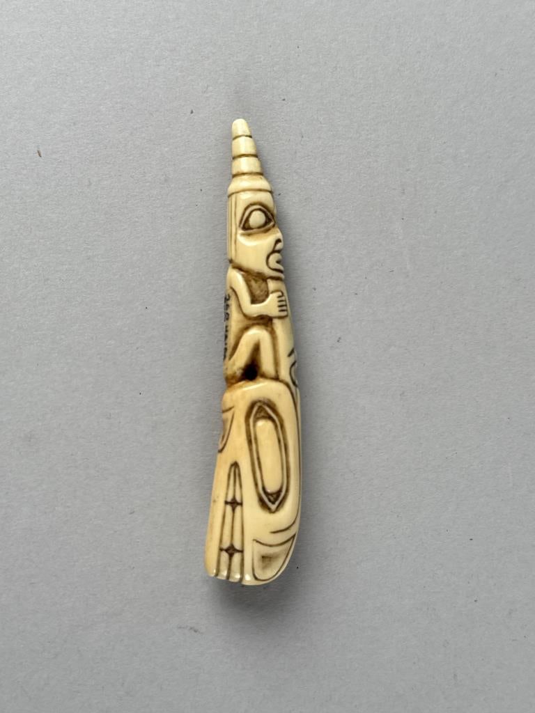 HAIDA CARVED WALRUS IVORY AMULET Late 19th/Early 20th Century Length 4".: HAIDA CARVED WALRUS IVORY AMULETLate 19th/Early 20th CenturyLength 4".