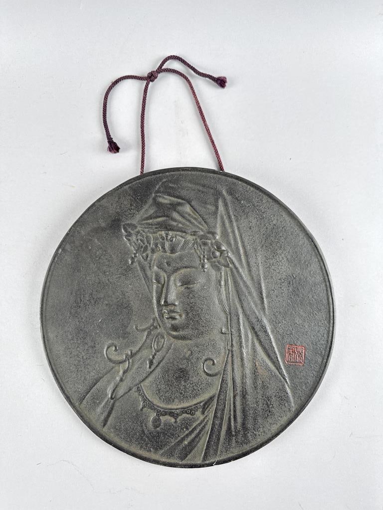 CHINESE BRONZE PLAQUE WITH BAS RELIEF DEPICTION OF GUANYIN Early 20th Century Diameter 13.25".: CHINESE BRONZE PLAQUE WITH BAS RELIEF DEPICTION OF GUANYINEarly 20th CenturySeal marked lower right.Diameter 13.25".