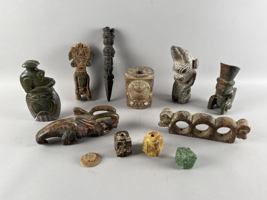 TWELVE ARTIFACTS, MOSTLY COLOMBIAN Heights from 2" to 11".: TWELVE ARTIFACTS, MOSTLY COLOMBIAN1) Colombian figural whistle.2-4) Three carved hardstone bugs.5) Colombian Chontal figure.6) Ram's-head gate handle.7) Carved hardstone object with bird.8-9) Two hard