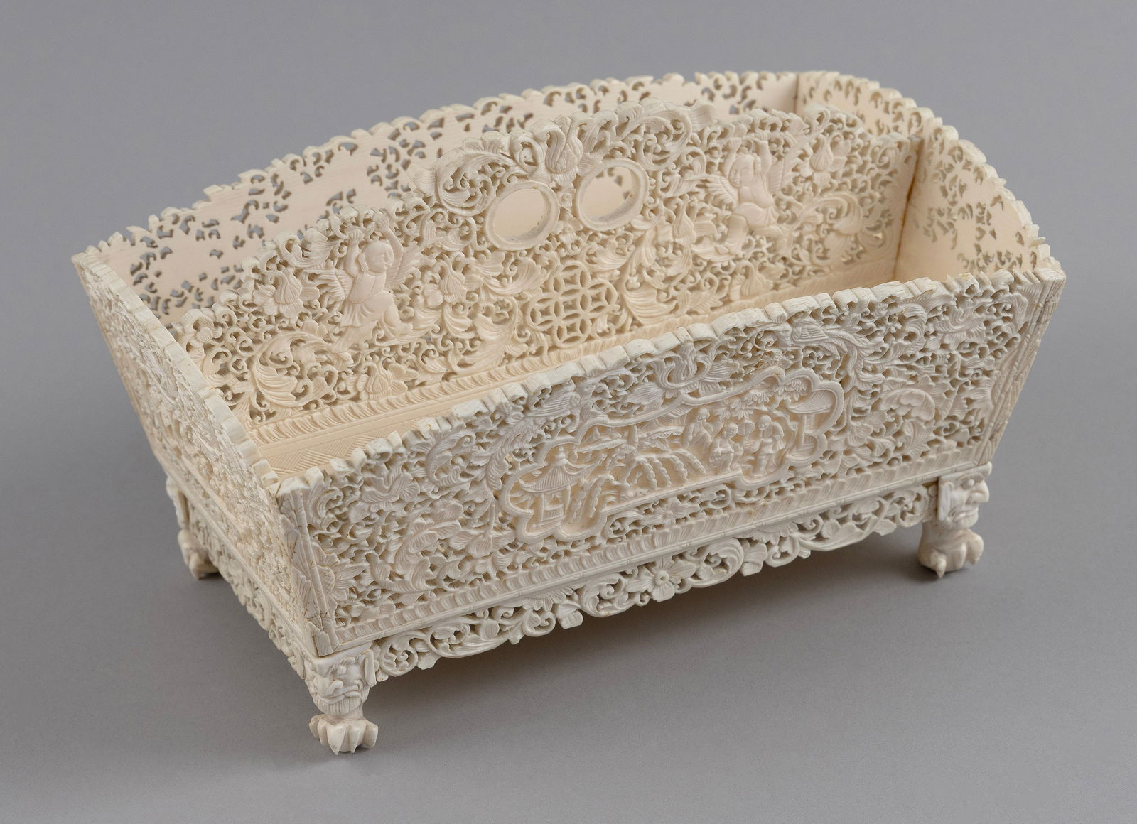 CHINESE EXPORT CARVED IVORY STATIONERY BOX Mid-19th Century Height 5". Length 8". Width 5.25".: CHINESE EXPORT CARVED IVORY STATIONERY BOXMid-19th CenturyExceptional pierced and relief-carved floral and fauna design. Demon's-mask legs with claw feet.Height 5". Length 8". Width 5.25".