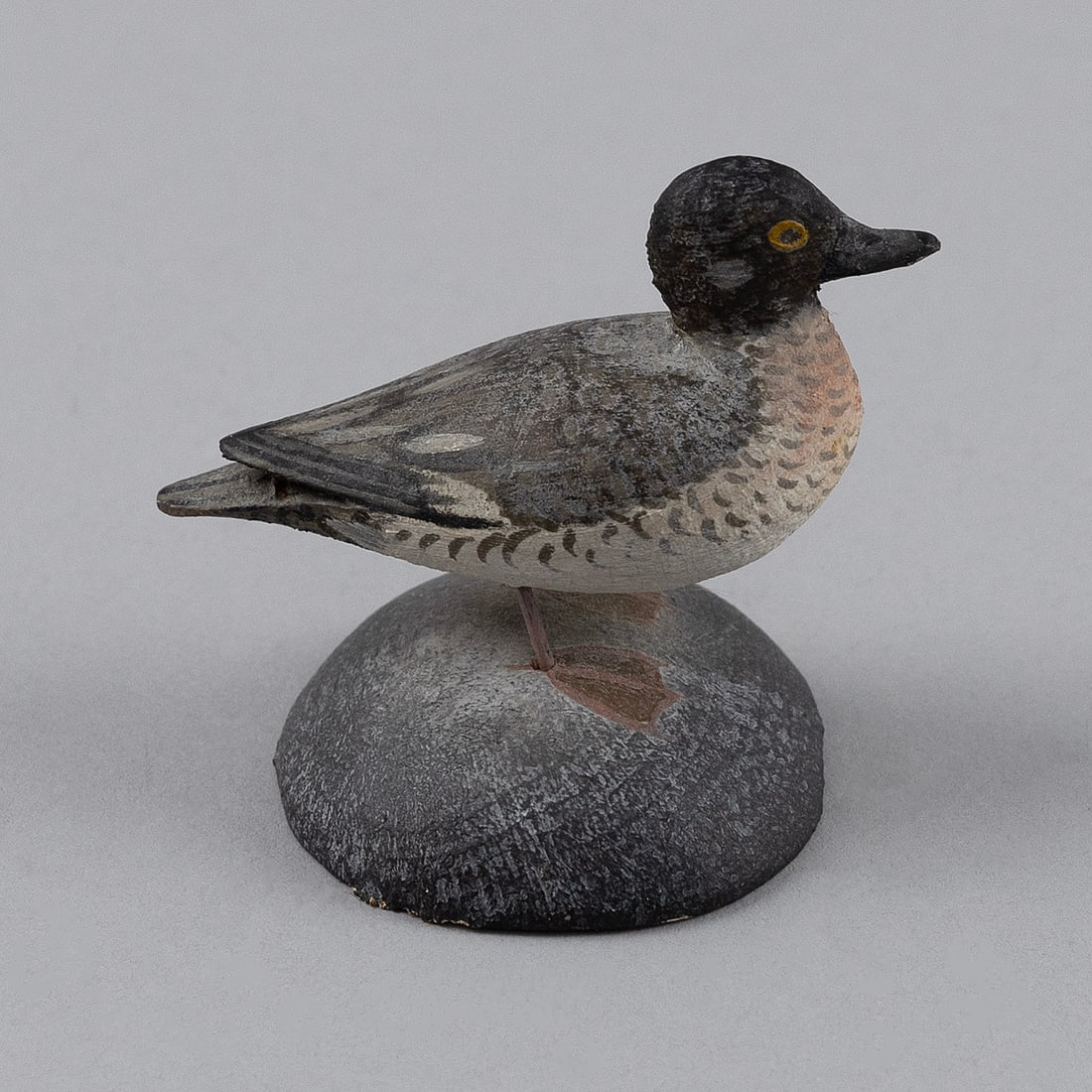 A. ELMER CROWELL BUFFLEHEAD HEN East Harwich, Massachusetts, 1862-1952 Height 2".: A. ELMER CROWELL BUFFLEHEAD HENEast Harwich, Massachusetts, 1862-1952Circa 1935. Mounted on a round base. Signed "A.E. Crowell Cape Cod".Height 2".