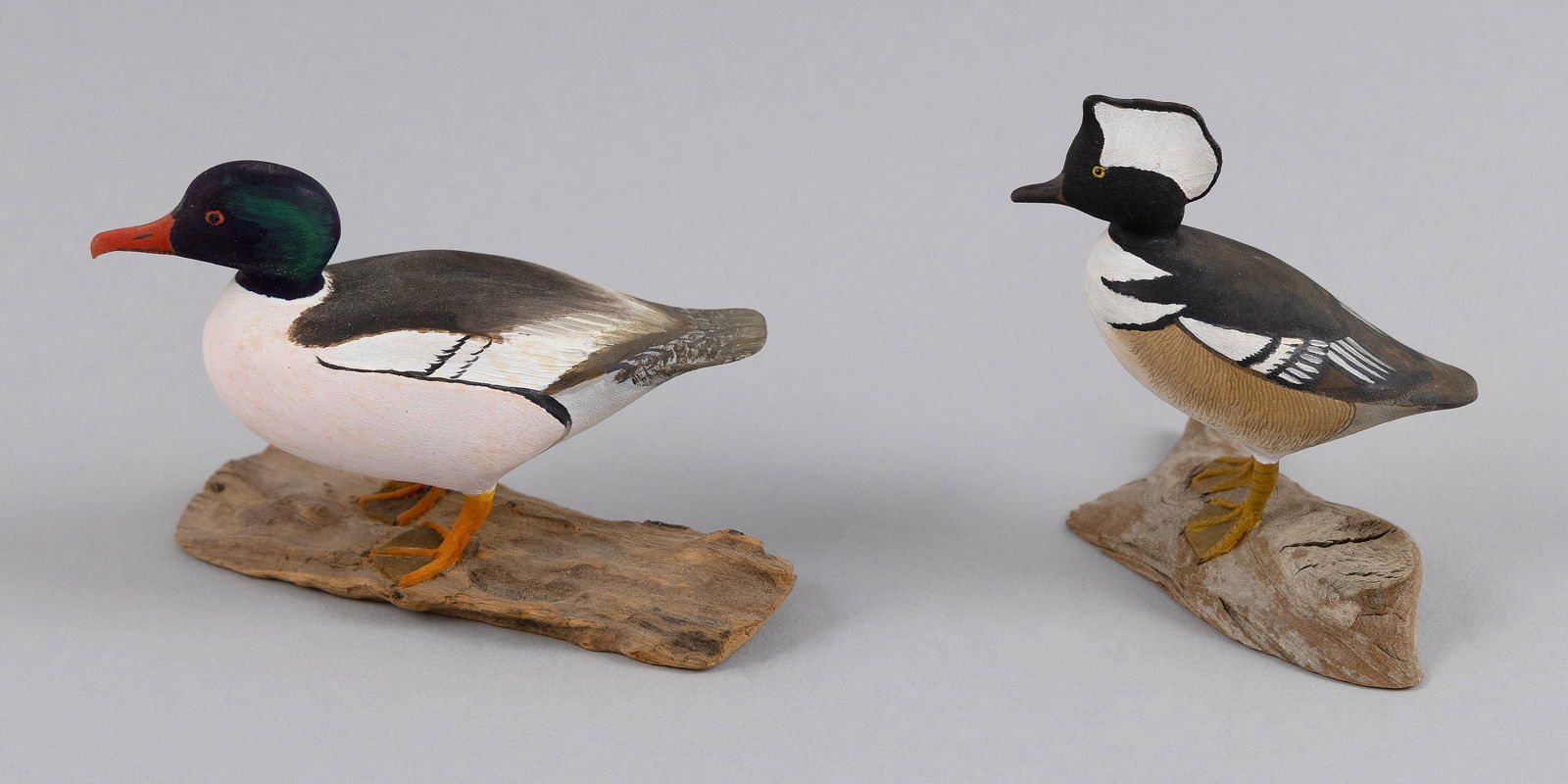 TWO HAROLD GIBBS MINIATURE MERGANSERS Barrington, Rhode Island, 1886-1970 Heights 3" and 2.5". (1 of 1)