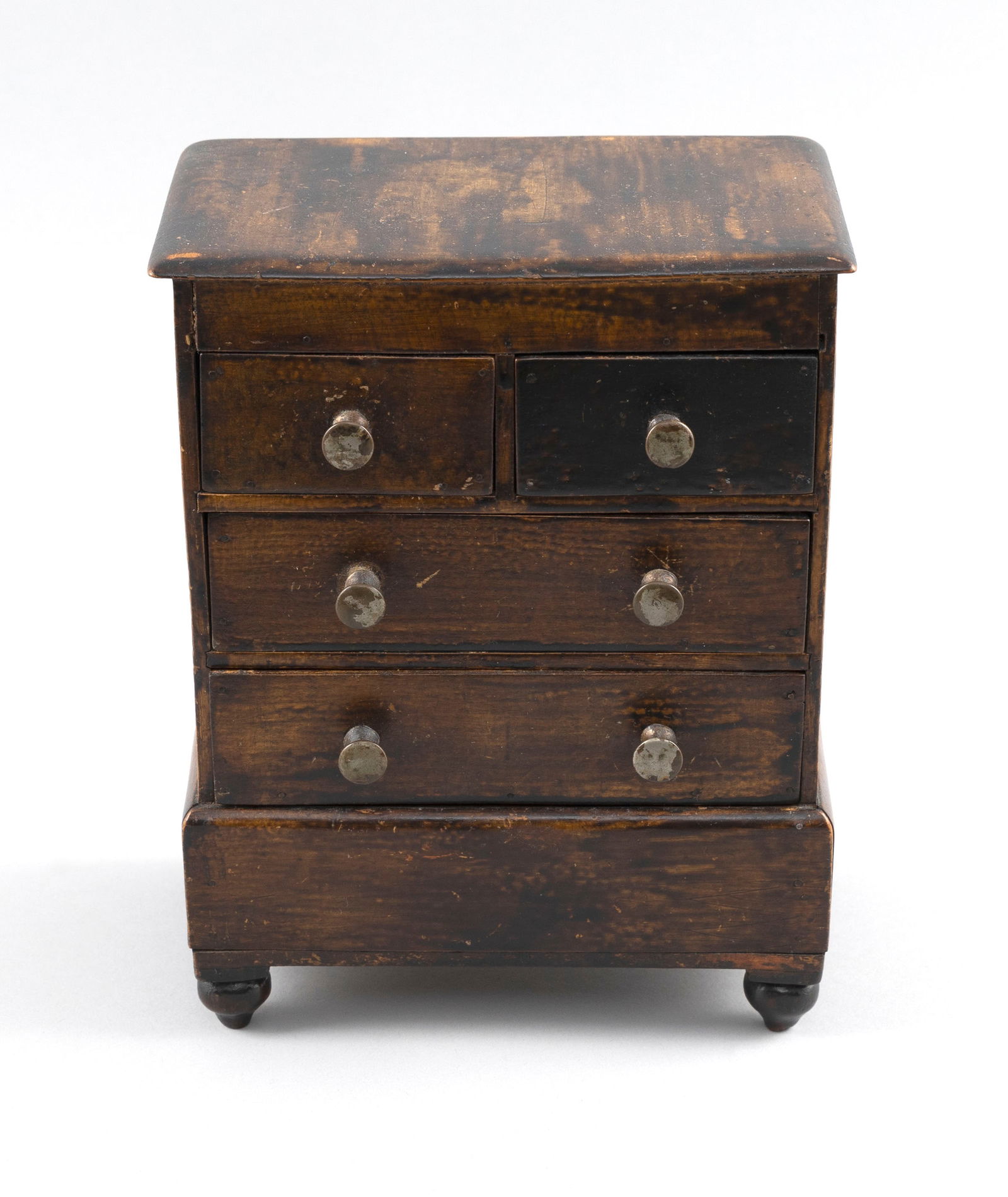MINIATURE FOUR-DRAWER CHEST Late 19th Century Height 7.5". Width 6.25". Depth 4". (1 of 4)