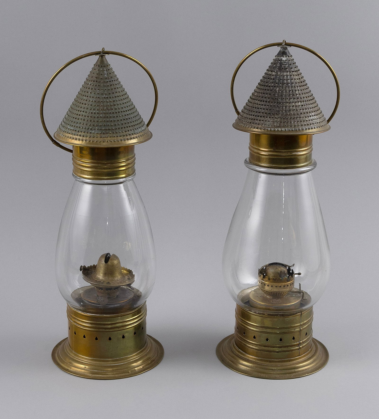PAIR OF HANGING BRASS LANTERNS America, Second Half of the 19th Century Heights 14.75".: PAIR OF HANGING BRASS LANTERNSAmerica, Second Half of the 19th CenturyHeights 14.75". Provenance:The Estate of Paul and Diane Madden, Sandwich, Massachusetts.