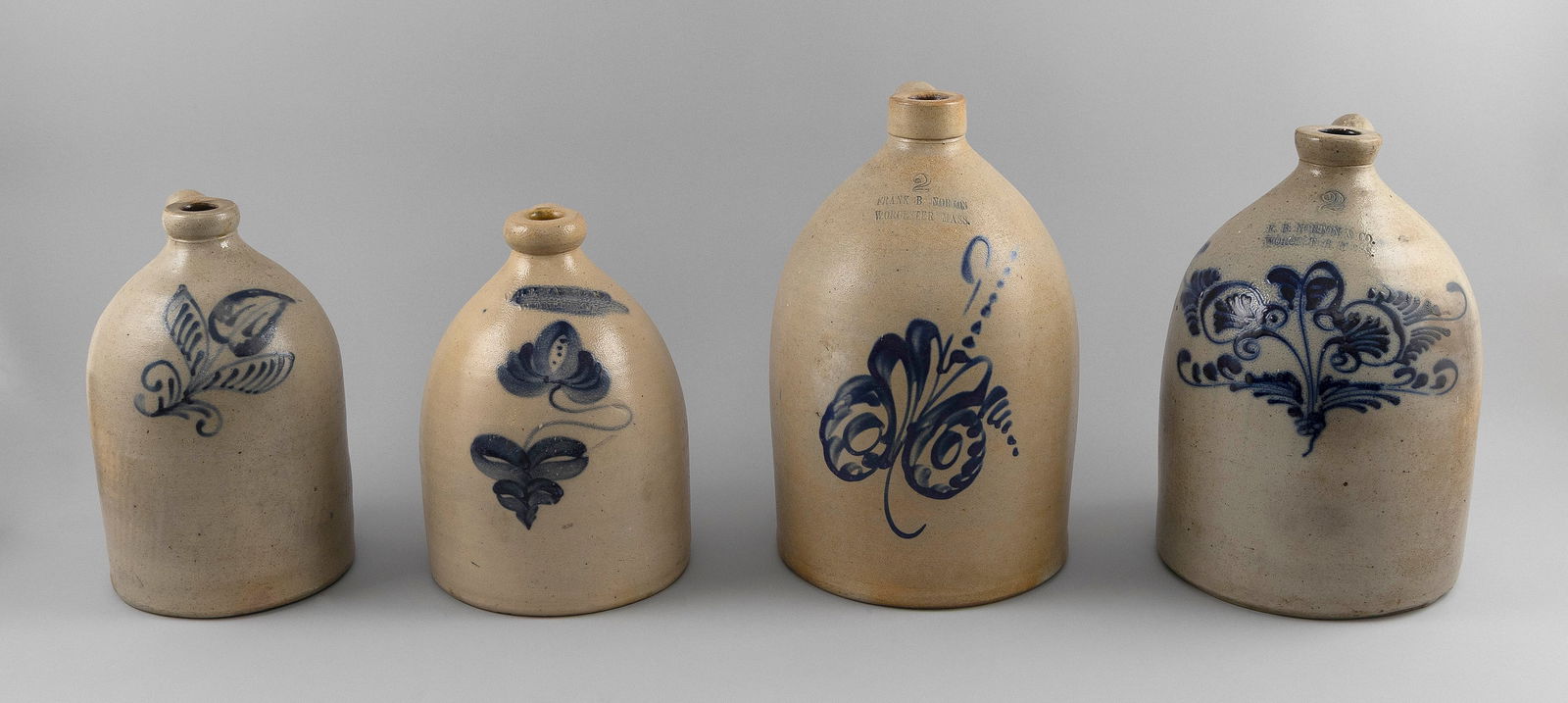 FOUR STONEWARE JUGS 19th Centuy Heights from 12" to 15". (1 of 1)