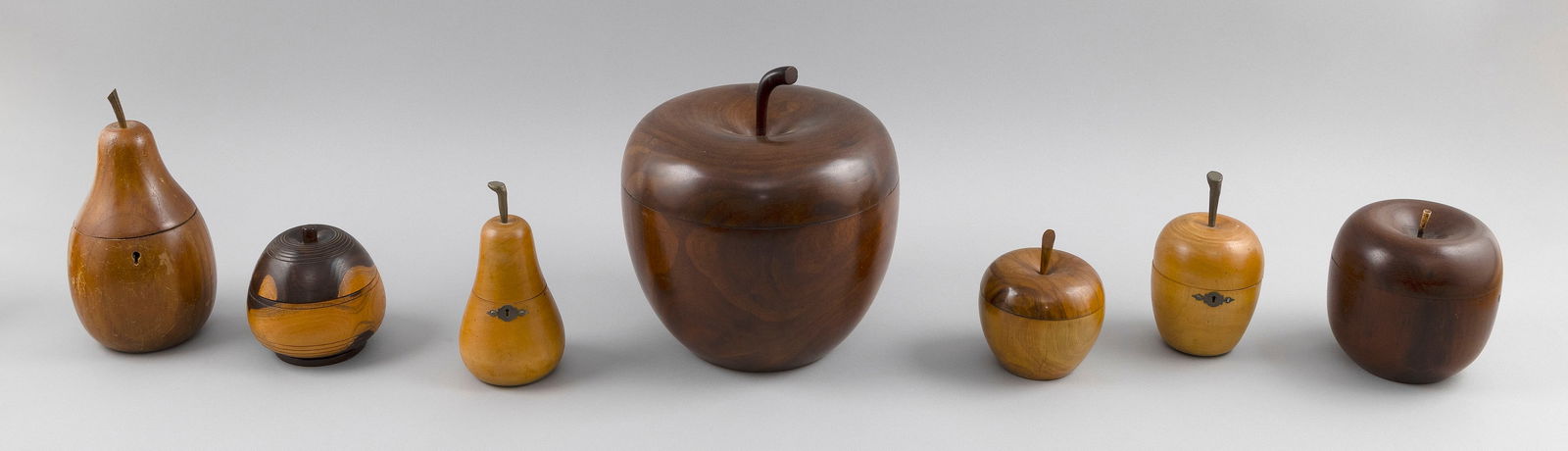 SEVEN FRUITWOOD AND BURLWOOD TEA CADDIES 20th Century Heights from 4.5" to 10".: SEVEN FRUITWOOD AND BURLWOOD TEA CADDIES20th CenturyFormed as apples and pears.Heights from 4.5" to 10".