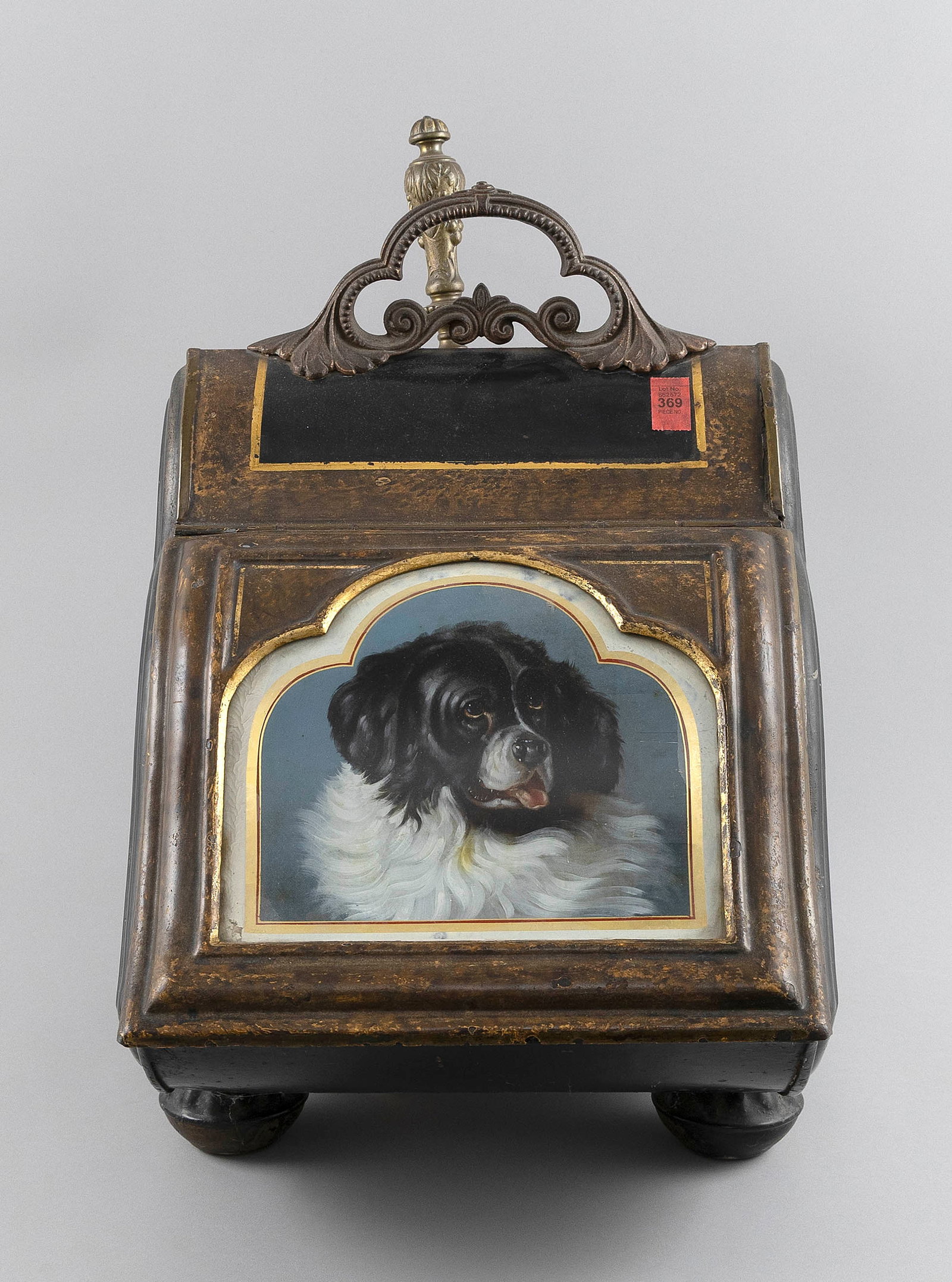 ORNATE COAL HOD Late 19th Century Height 20". Width 12.5". Depth 17".: ORNATE COAL HODLate 19th CenturyPainted metal with a porcelain portrait of a dog on the lid. Complete with original shovel.Height 20". Width 12.5". Depth 17".