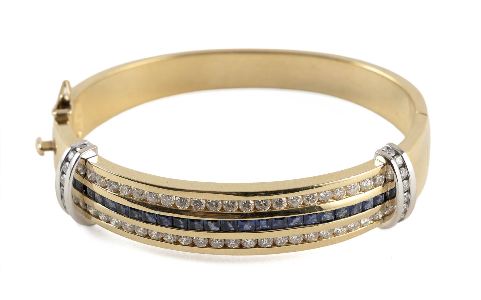 14KT YELLOW AND WHITE GOLD, DIAMOND AND SAPPHIRE BANGLE BRACELET Approx. 37.3 total dwt.: 14KT YELLOW AND WHITE GOLD, DIAMOND AND SAPPHIRE BANGLE BRACELET58 round-cut diamonds, approx. 2.00 ctw., and 21 square-cut sapphires, approx. 1.00 ctw. Box clasp with fold-over safety. Stamped. Appro