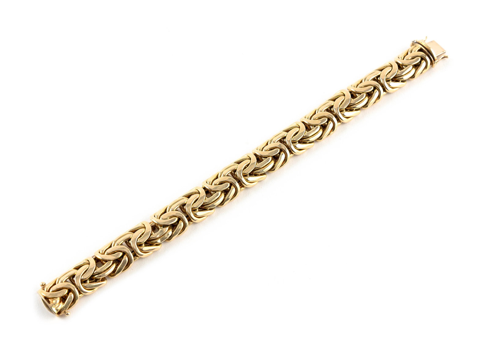 14KT YELLOW GOLD FLEXIBLE LINK BRACELET Approx. 22.8 total dwt.: 14KT YELLOW GOLD FLEXIBLE LINK BRACELETBox clasp with double fold-over safety. Stamped "14k Italy". Width approx. 14.0mm. Length 7.5".Approx. 22.8 total dwt.