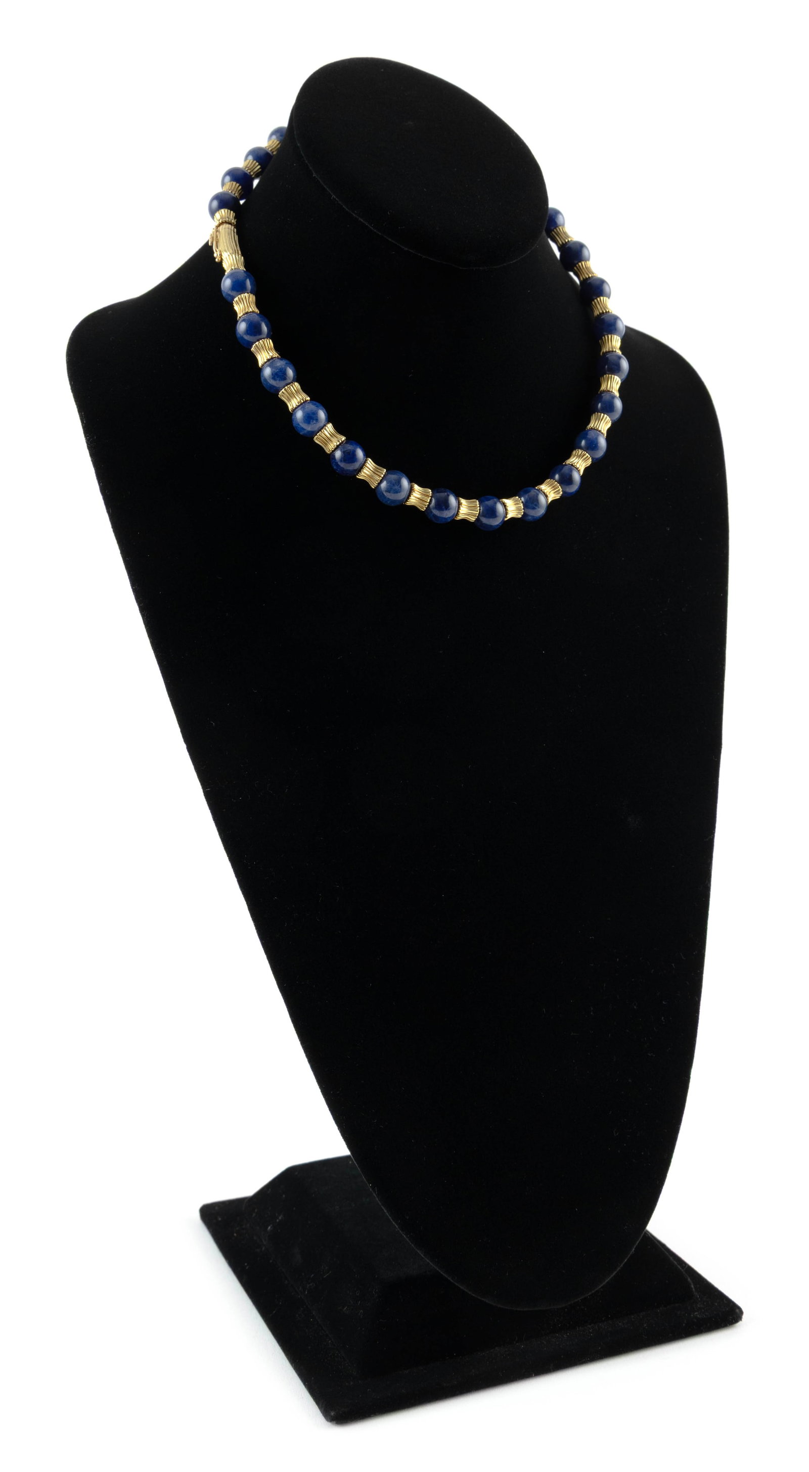 ILIAS LALAOUNIS 18KT YELLOW GOLD AND LAPIS LAZULI NECKLACE: ILIAS LALAOUNIS 18KT YELLOW GOLD AND LAPIS LAZULI NECKLACE27 approx. 10.0mm round lapis lazuli beads and 28 approx. 6.0 x 6.0mm gold ribbed spacers. Box clasp with fold-over safety. Stamped "750 Greec