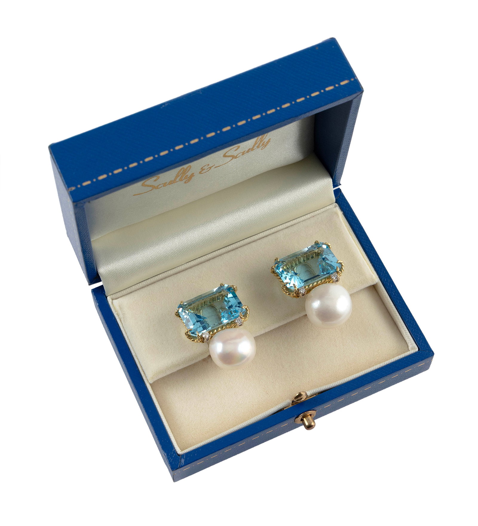 PAIR OF SCULLY & SCULLY 18KT YELLOW GOLD, BLUE TOPAZ AND FRESHWATER PEARL EARRINGS: PAIR OF SCULLY & SCULLY 18KT YELLOW GOLD, BLUE TOPAZ AND FRESHWATER PEARL EARRINGSEach with one approx. 18.0mm freshwater pearl and one approx. 13.0 x 18.0 x 9.0mm approx. 19.0 cts. emerald-cut blue t