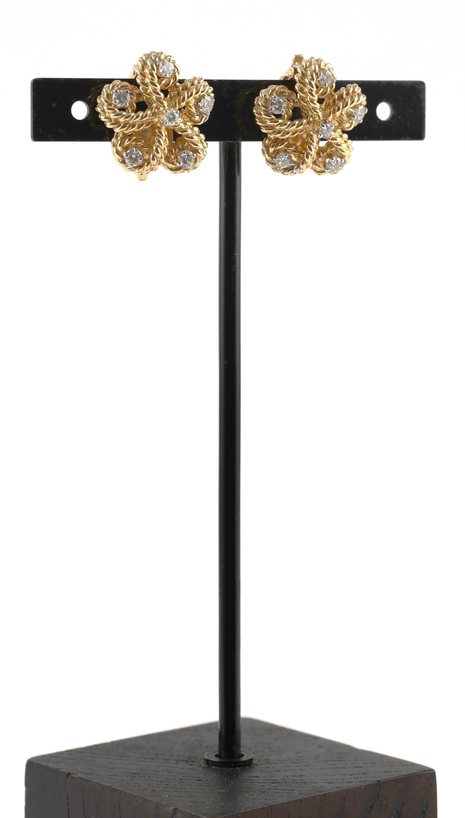 PAIR OF TIFFANY & CO. 18KT YELLOW GOLD AND DIAMOND EARRINGS Approx. 12.7 total dwt.: PAIR OF TIFFANY & CO. 18KT YELLOW GOLD AND DIAMOND EARRINGSFloral design. Each with six round-cut diamonds, approx. 0.30 ctw. Clip backs. Stamped. Approx. 20.0mm.Approx. 12.7 total dwt.