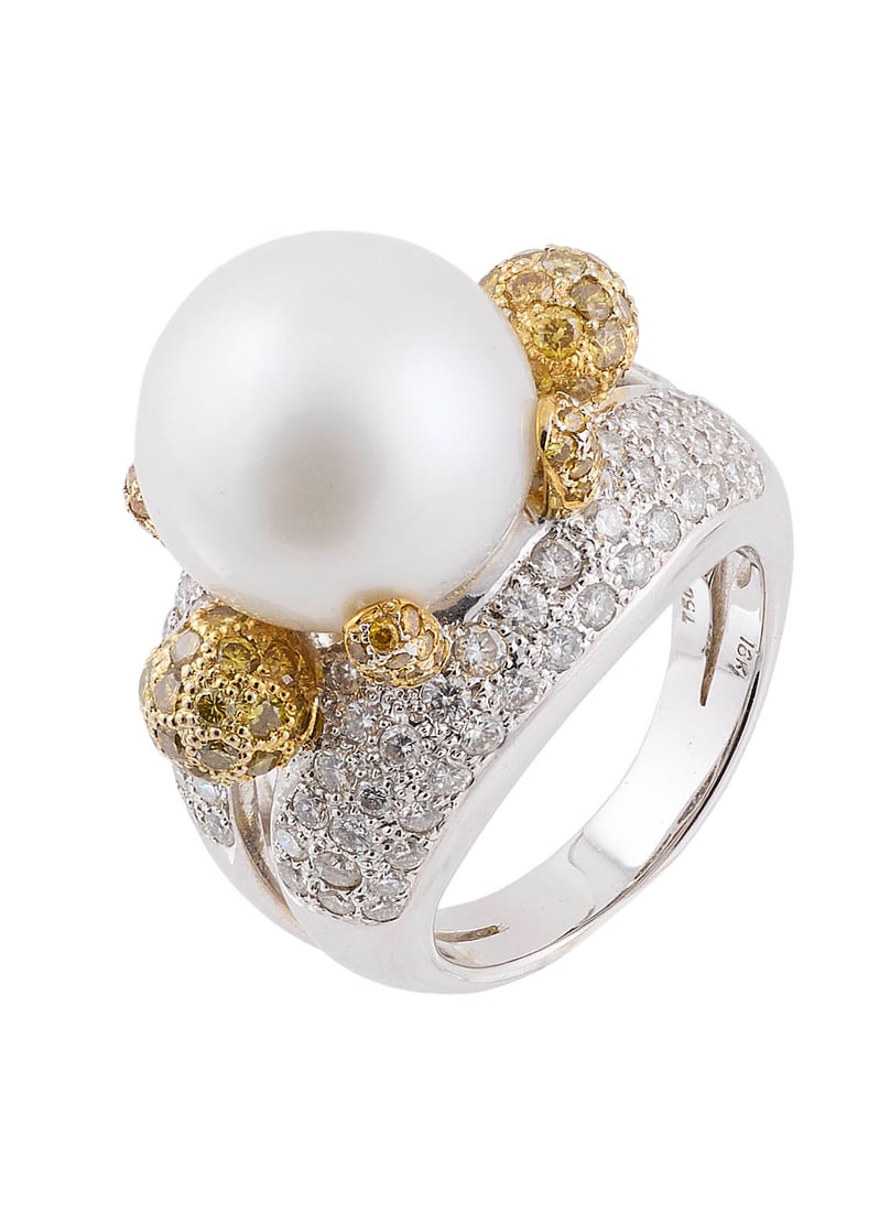 18KT WHITE AND YELLOW GOLD, SOUTH SEA CULTURED PEARL AND DIAMOND RING Approx. 12.3 total dwt.: 18KT WHITE AND YELLOW GOLD, SOUTH SEA CULTURED PEARL AND DIAMOND RINGOne approx. 14.0mm round cultured/South Sea pearl. White gold mounting set with approx. 86 small round-cut diamonds, approx. 0.86 c