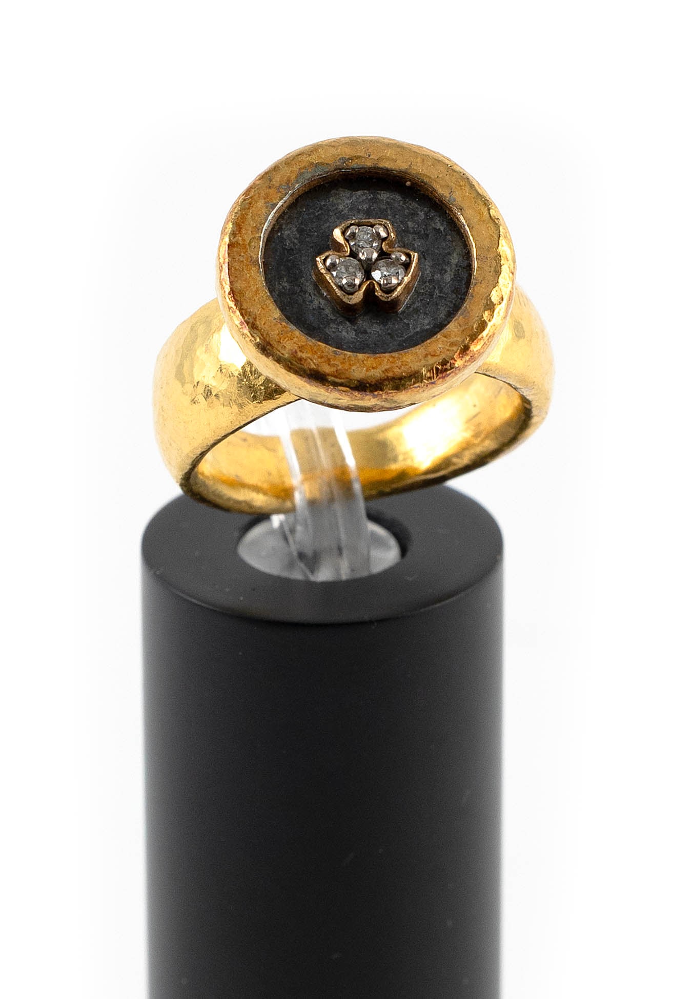 22KT YELLOW GOLD AND DIAMOND RING Approx. 7.7 total dwt.: 22KT YELLOW GOLD AND DIAMOND RINGOxidized inside with three small round-cut diamonds. Hammered finish. Shank tapers from approx. 7.0 to 4.0mm. Top approx. 15.0 x 15.0mm. Size 5?.Approx. 7.7 total dwt.