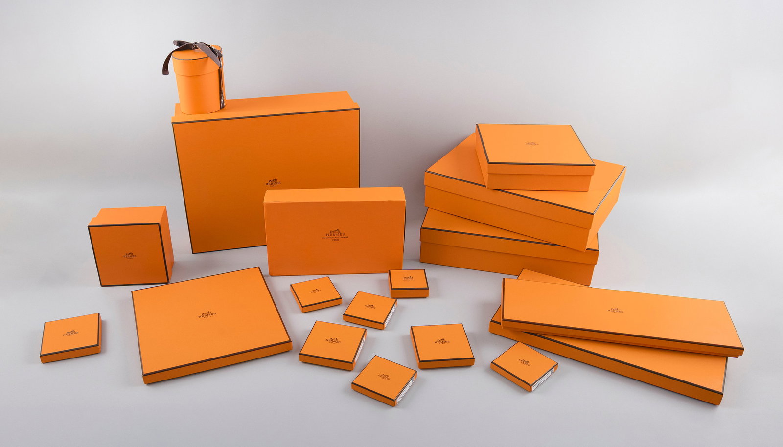 SIXTEEN ASSORTED HERMES BOXES 20th Century From 2.5" x 2.75" to 14" x 11.5".: SIXTEEN ASSORTED HERMES BOXES20th CenturyFor jewelry, watches and other accessories and clothing. Sizes and shapes vary. Some include tissue and ribbons.From 2.5" x 2.75" to 14" x 11.5".