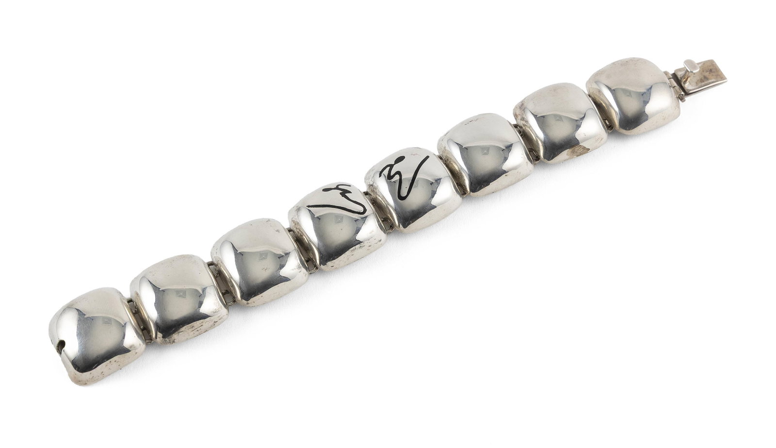 STERLING SILVER FLEXIBLE LINK BRACELET Approx. 53.8 total dwt.: STERLING SILVER FLEXIBLE LINK BRACELETHollow pillow style links, approx. 8.0 x 25.0mm, the two middle links with black design. Box clasp. Stamped "925 Mexico Sterling". Width approx. 25.0mm. Length 8"